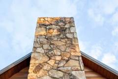 Stone Chimney on Log Cabin